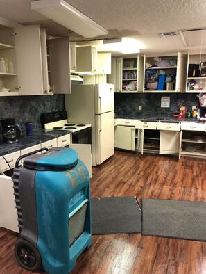 Water damage in Bigfoot from appliance leak by Complete Clean Restoration